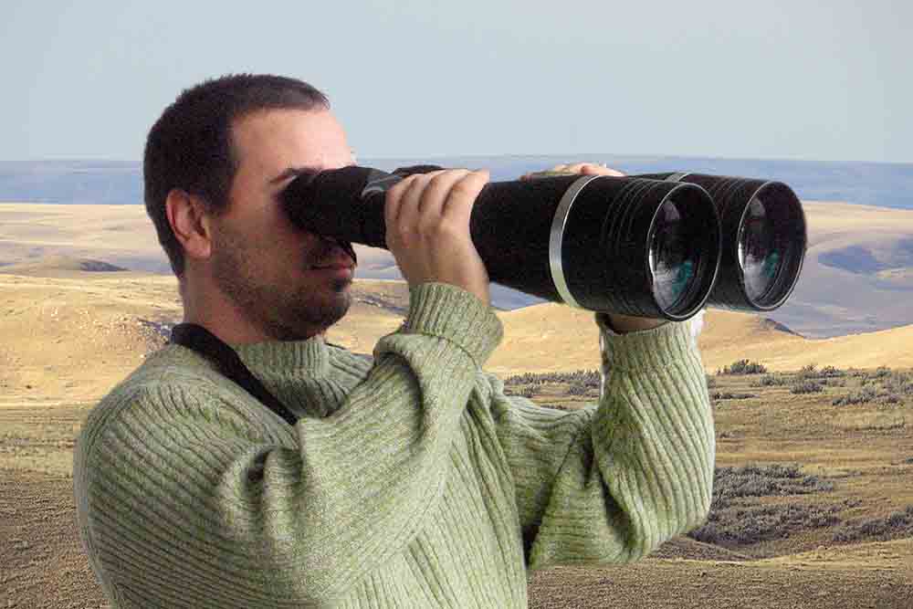 Man using oversized binoculars